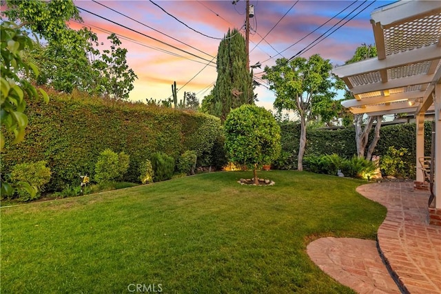 9214 Mclennan Ave, Northridge, CA 91343 - yard at dusk featuring a fenced backyard, a pergola, and a patio
