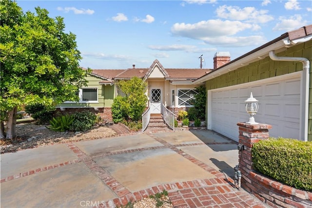 9214 Mclennan Ave, Northridge, CA 91343 - ranch-style home with driveway, a chimney, and a garage
