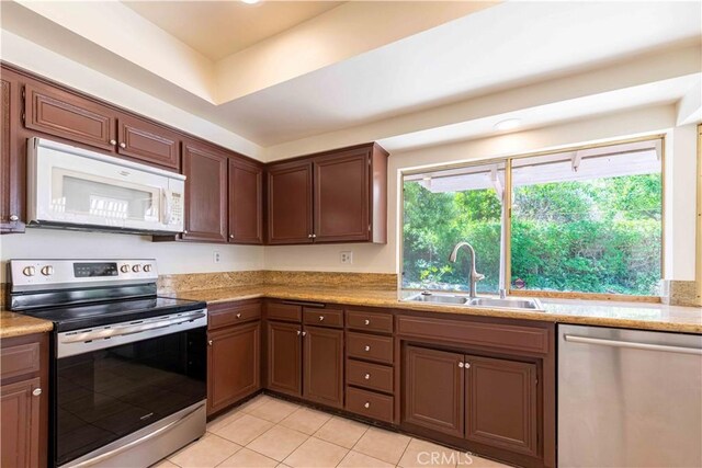 28752 Pisces St, Agoura Hills, CA 91301 - kitchen featuring stainless steel appliances, light tile patterned floors, and light countertops