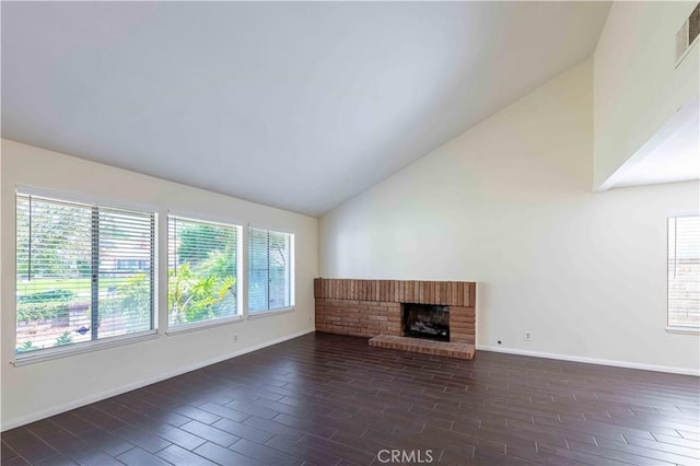 28752 Pisces St, Agoura Hills, CA 91301 - unfurnished living room with vaulted ceiling, dark wood finished floors, and a brick fireplace