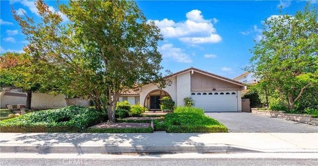 28752 Pisces St, Agoura Hills, CA 91301 - view of front of property with a garage, stucco siding, asphalt driveway, and a tile roof