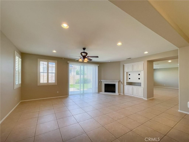 41926 Bonita Dr, Palmdale, CA 93551 - unfurnished living room with light tile patterned floors, ceiling fan, recessed lighting, and a fireplace with raised hearth