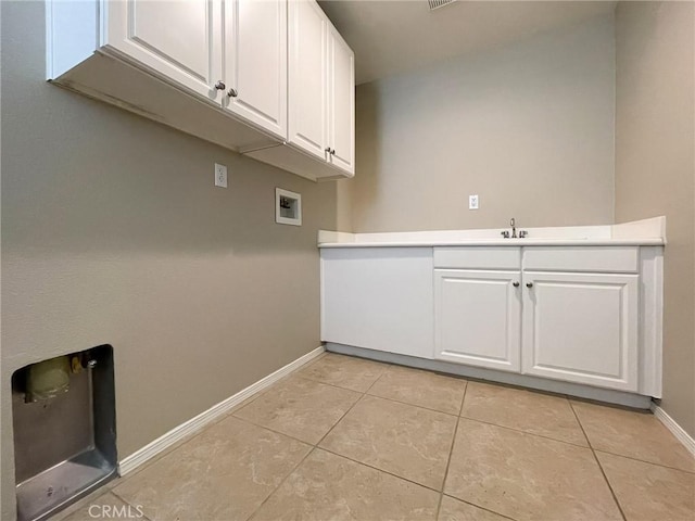 41926 Bonita Dr, Palmdale, CA 93551 - laundry room with hookup for a washing machine, light tile patterned floors, and cabinet space