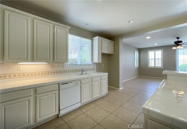 41926 Bonita Dr, Palmdale, CA 93551 - kitchen with dishwasher, tile countertops, light tile patterned flooring, decorative backsplash, and recessed lighting