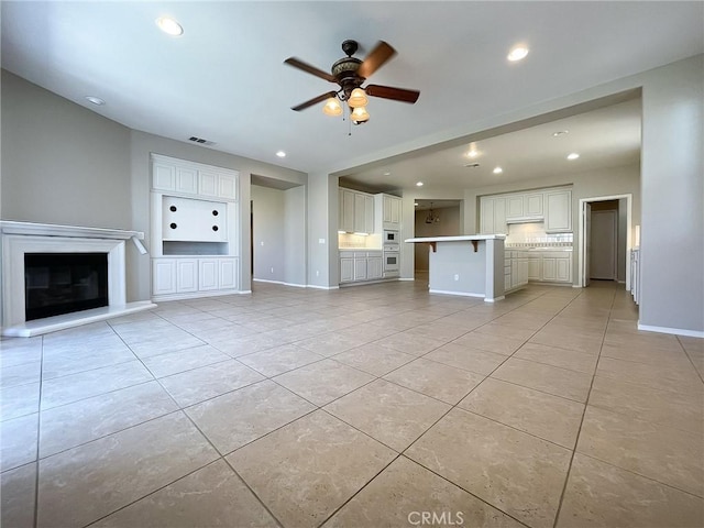 41926 Bonita Dr, Palmdale, CA 93551 - unfurnished living room featuring a ceiling fan, recessed lighting, and light tile patterned floors