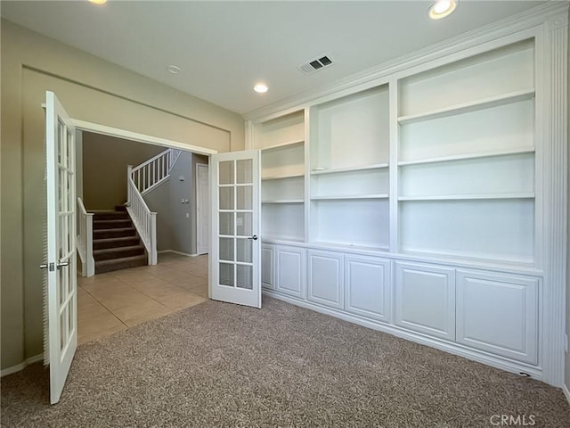 41926 Bonita Dr, Palmdale, CA 93551 - empty room featuring french doors, light colored carpet, stairway, light tile patterned flooring, and recessed lighting