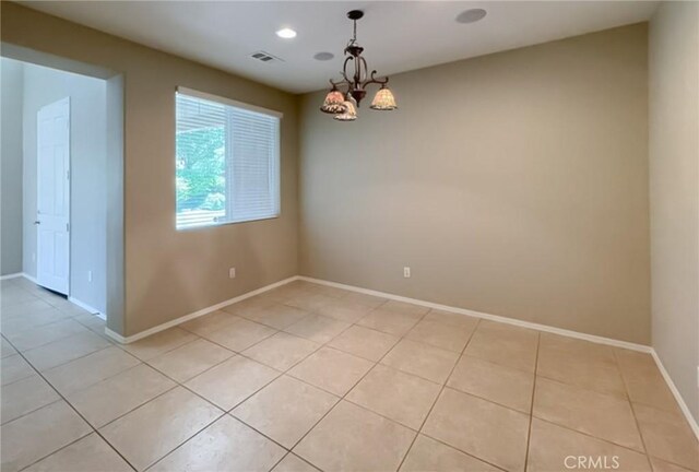 41926 Bonita Dr, Palmdale, CA 93551 - spare room featuring light tile patterned floors and a chandelier