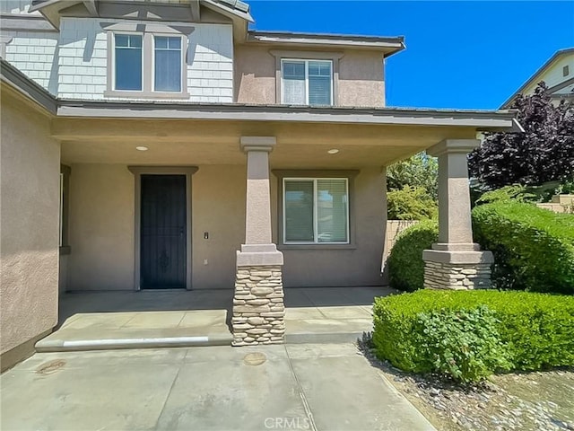 41926 Bonita Dr, Palmdale, CA 93551 - doorway to property with covered porch and stucco siding