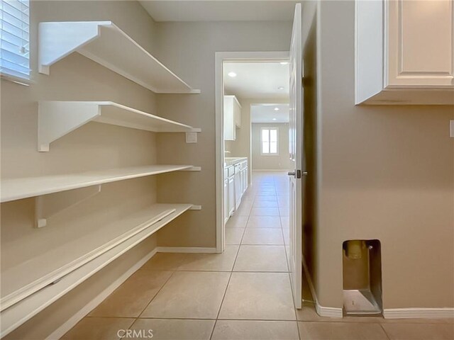 41926 Bonita Dr, Palmdale, CA 93551 - hallway with light tile patterned flooring and baseboards