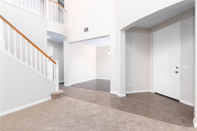 30315 Laruns St, Murrieta, CA 92563 - tiled foyer entrance with carpet, stairway, and a high ceiling