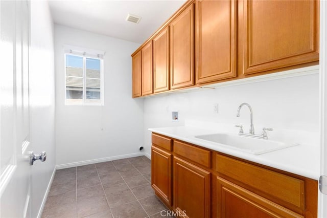 30315 Laruns St, Murrieta, CA 92563 - laundry area featuring hookup for a washing machine, cabinet space, and light tile patterned floors