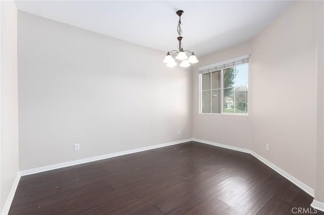 30315 Laruns St, Murrieta, CA 92563 - spare room featuring a chandelier and dark wood finished floors