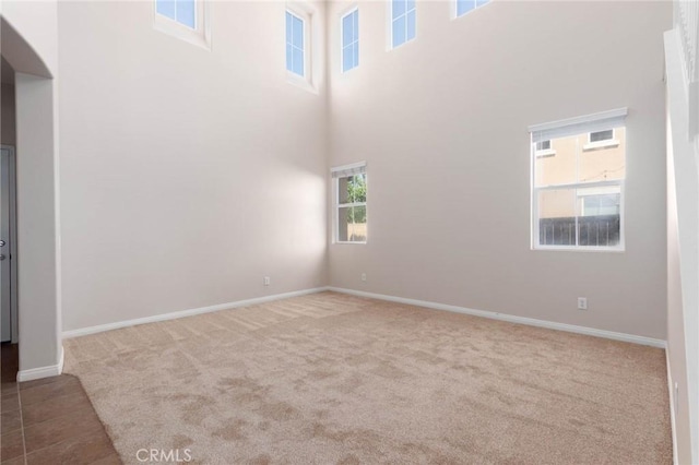 30315 Laruns St, Murrieta, CA 92563 - spare room featuring carpet floors and a towering ceiling