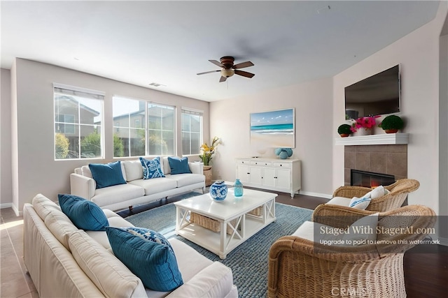 30315 Laruns St, Murrieta, CA 92563 - living room with a ceiling fan, a tile fireplace, and wood finished floors