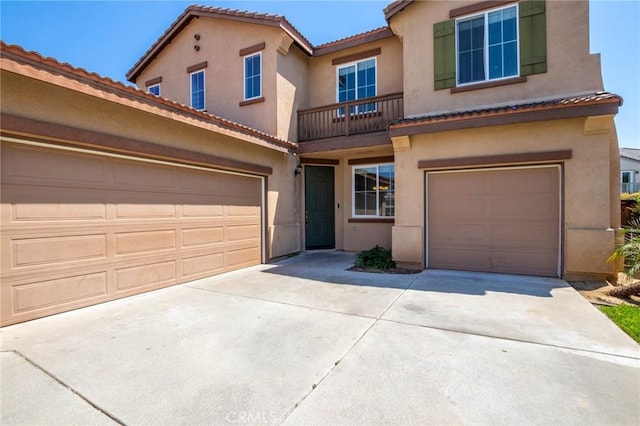 30315 Laruns St, Murrieta, CA 92563 - view of front of house featuring concrete driveway, stucco siding, an attached garage, and a tiled roof