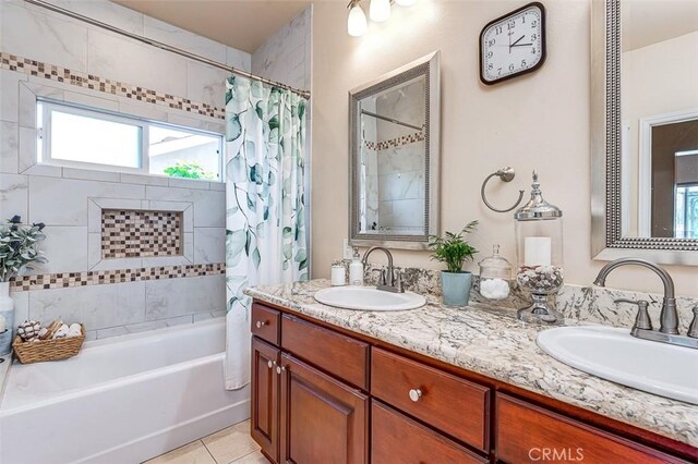 335 E Francis Ave, La Habra, CA 90631 - bathroom featuring shower / bath combination with curtain, double vanity, healthy amount of natural light, and tile patterned floors