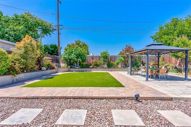 335 E Francis Ave, La Habra, CA 90631 - fenced backyard featuring a gazebo and a patio area