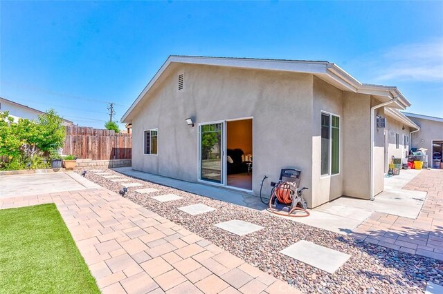 335 E Francis Ave, La Habra, CA 90631 - back of house with a patio and stucco siding