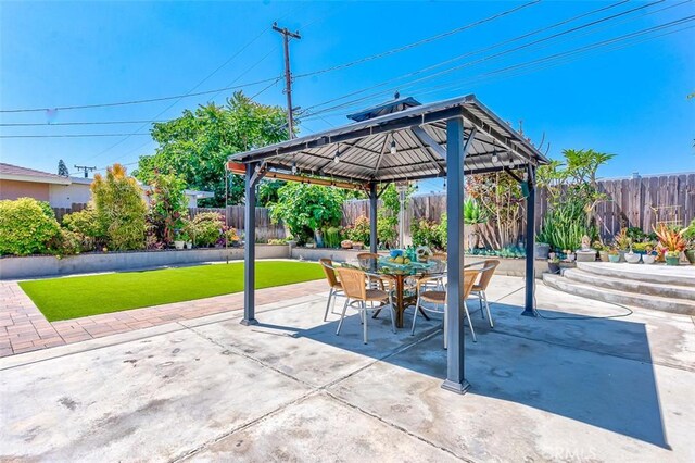 335 E Francis Ave, La Habra, CA 90631 - fenced backyard with a gazebo, a patio, and outdoor dining area