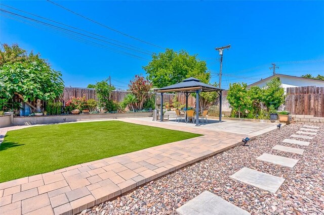 335 E Francis Ave, La Habra, CA 90631 - fenced backyard featuring a gazebo and a patio