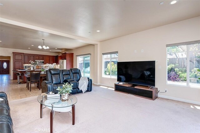 335 E Francis Ave, La Habra, CA 90631 - living area with healthy amount of natural light, a chandelier, recessed lighting, and light colored carpet
