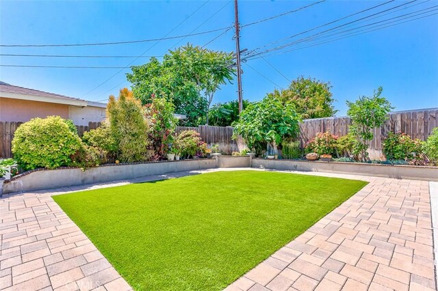 335 E Francis Ave, La Habra, CA 90631 - fenced backyard featuring a patio