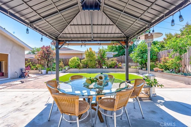 335 E Francis Ave, La Habra, CA 90631 - fenced backyard featuring a gazebo, a patio, and outdoor dining space