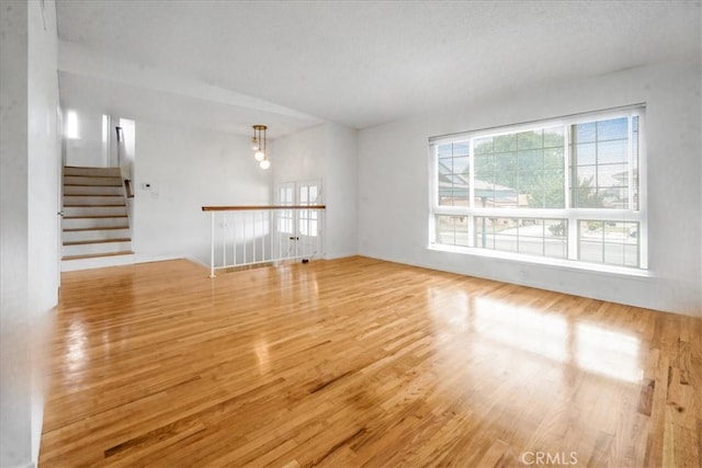 1129 Belbury Dr, Walnut, CA 91789 - unfurnished living room featuring wood finished floors and stairway