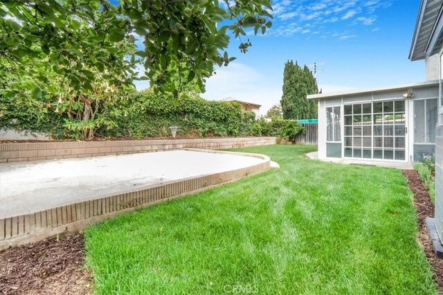 1129 Belbury Dr, Walnut, CA 91789 - fenced backyard with a sunroom and a patio