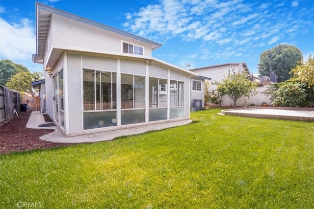 1129 Belbury Dr, Walnut, CA 91789 - rear view of property with stucco siding, a fenced backyard, and a sunroom