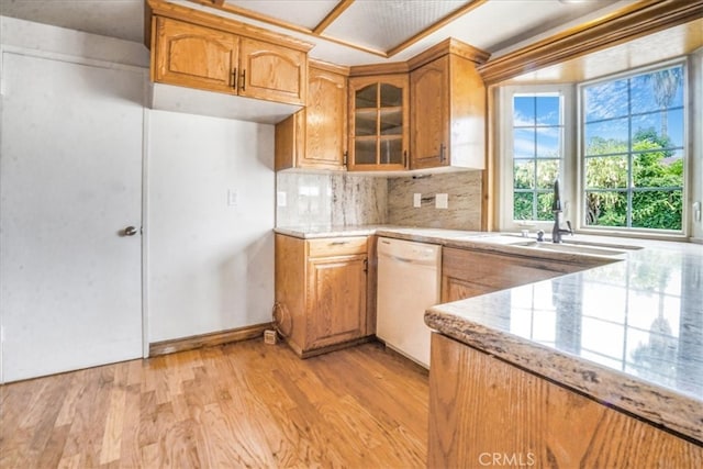 1129 Belbury Dr, Walnut, CA 91789 - kitchen featuring white dishwasher, light wood finished floors, tasteful backsplash, glass insert cabinets, and brown cabinets