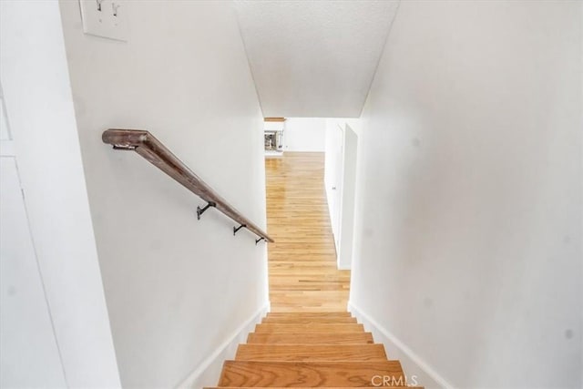 1129 Belbury Dr, Walnut, CA 91789 - stairway featuring wood finished floors and baseboards