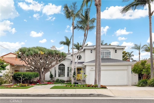 558 24th St, Hermosa Beach, CA 90254 - view of front of property featuring concrete driveway, an attached garage, and brick siding