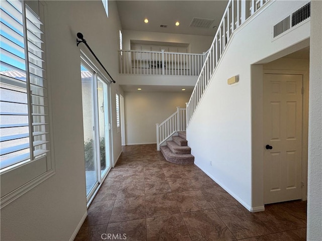 33314 Lazurite Way, Menifee, CA 92584 - entrance foyer featuring a high ceiling, stairs, and recessed lighting