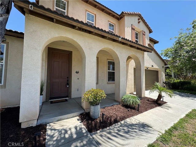 33314 Lazurite Way, Menifee, CA 92584 - entrance to property with stucco siding, an attached garage, and driveway