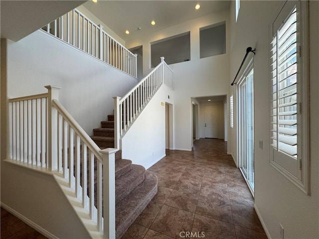 33314 Lazurite Way, Menifee, CA 92584 - staircase with a high ceiling and recessed lighting