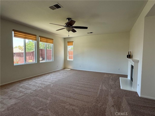 33314 Lazurite Way, Menifee, CA 92584 - unfurnished living room with carpet floors, a ceiling fan, and a fireplace with raised hearth