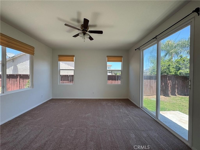 33314 Lazurite Way, Menifee, CA 92584 - empty room featuring a ceiling fan and dark colored carpet