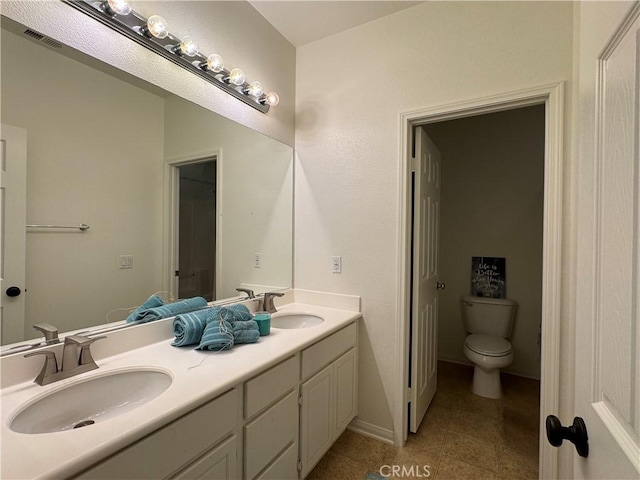 33314 Lazurite Way, Menifee, CA 92584 - bathroom with double vanity and toilet