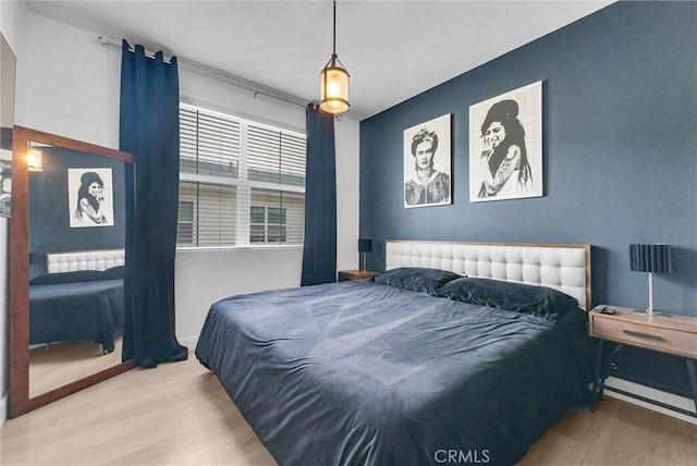 12342 Blue Sky Ct, Whittier, CA 90602 - bedroom with wood finished floors and radiator