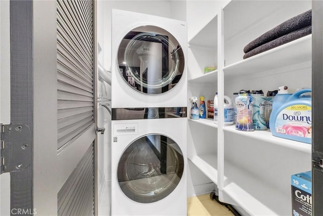 12342 Blue Sky Ct, Whittier, CA 90602 - laundry room with stacked washer / drying machine and tile patterned flooring