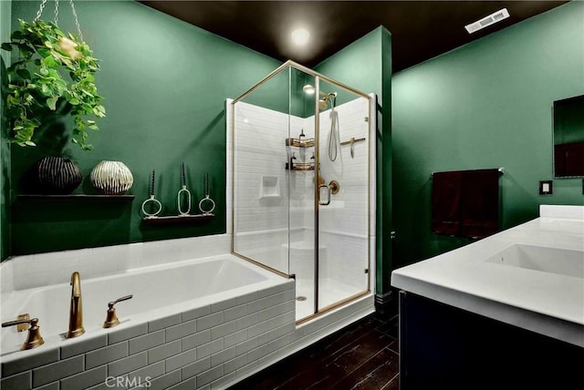 12342 Blue Sky Ct, Whittier, CA 90602 - bathroom featuring a garden tub, a shower stall, vanity, and wood finished floors
