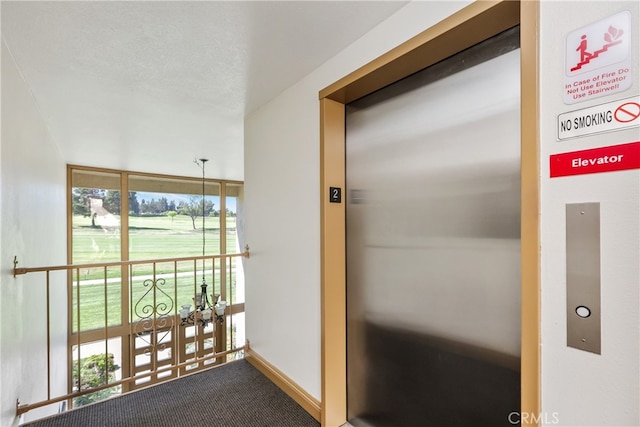 2386 Via Mariposa W Unit 2B, Laguna Woods, CA 92637 - hallway featuring elevator and carpet