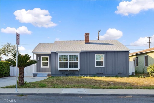 1517 W Grand Ave, Pomona, CA 91766 - bungalow featuring crawl space, a chimney, and board and batten siding