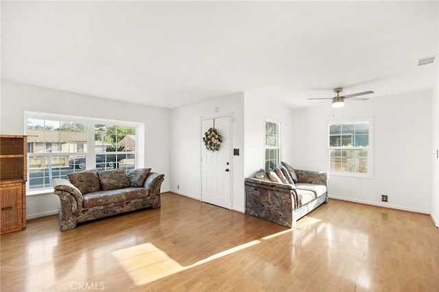 1517 W Grand Ave, Pomona, CA 91766 - living area featuring wood finished floors, plenty of natural light, and a ceiling fan