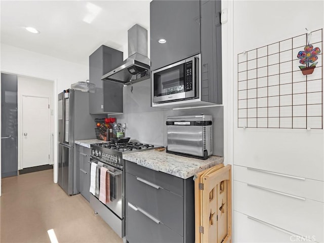 15017 Archwood St, Van Nuys, CA 91405 - kitchen with appliances with stainless steel finishes, wall chimney exhaust hood, gray cabinets, light stone counters, and recessed lighting