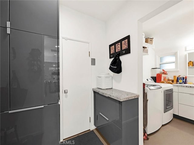 15017 Archwood St, Van Nuys, CA 91405 - kitchen featuring washer and dryer and light countertops