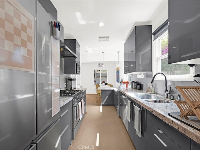 15017 Archwood St, Van Nuys, CA 91405 - kitchen featuring stainless steel appliances, light stone counters, hanging light fixtures, modern cabinets, and gray cabinetry