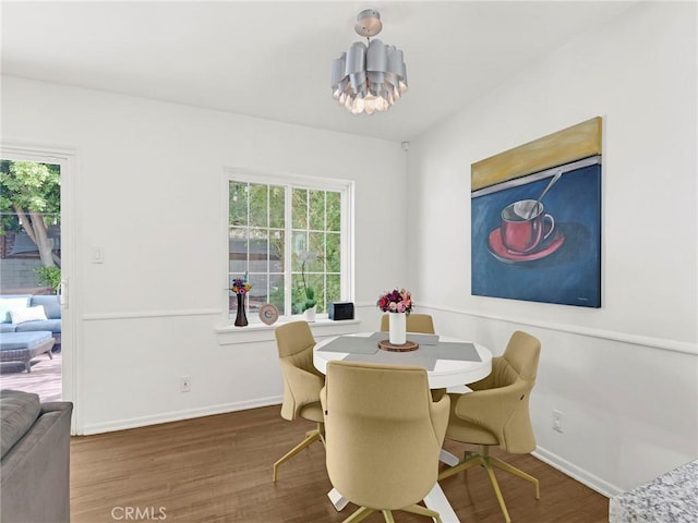 15017 Archwood St, Van Nuys, CA 91405 - dining area featuring plenty of natural light, wood finished floors, and a chandelier
