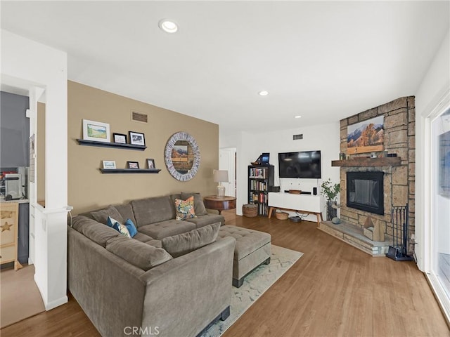 15017 Archwood St, Van Nuys, CA 91405 - living room with wood finished floors, a fireplace, and recessed lighting